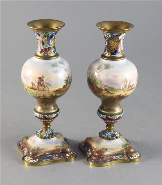 A pair of early 20th century French champleve enamel and porcelain candlesticks 7.5in.